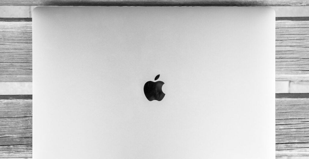 Apple logo displayed on a sleek electronic device Mackbook Pro.