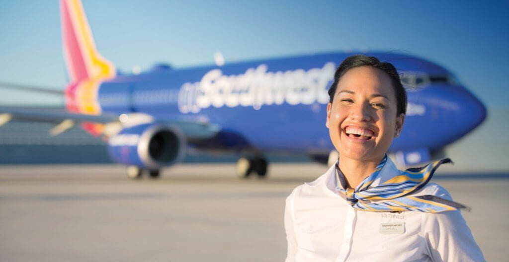 Southwest Airlines plane with cheerful flight attendants